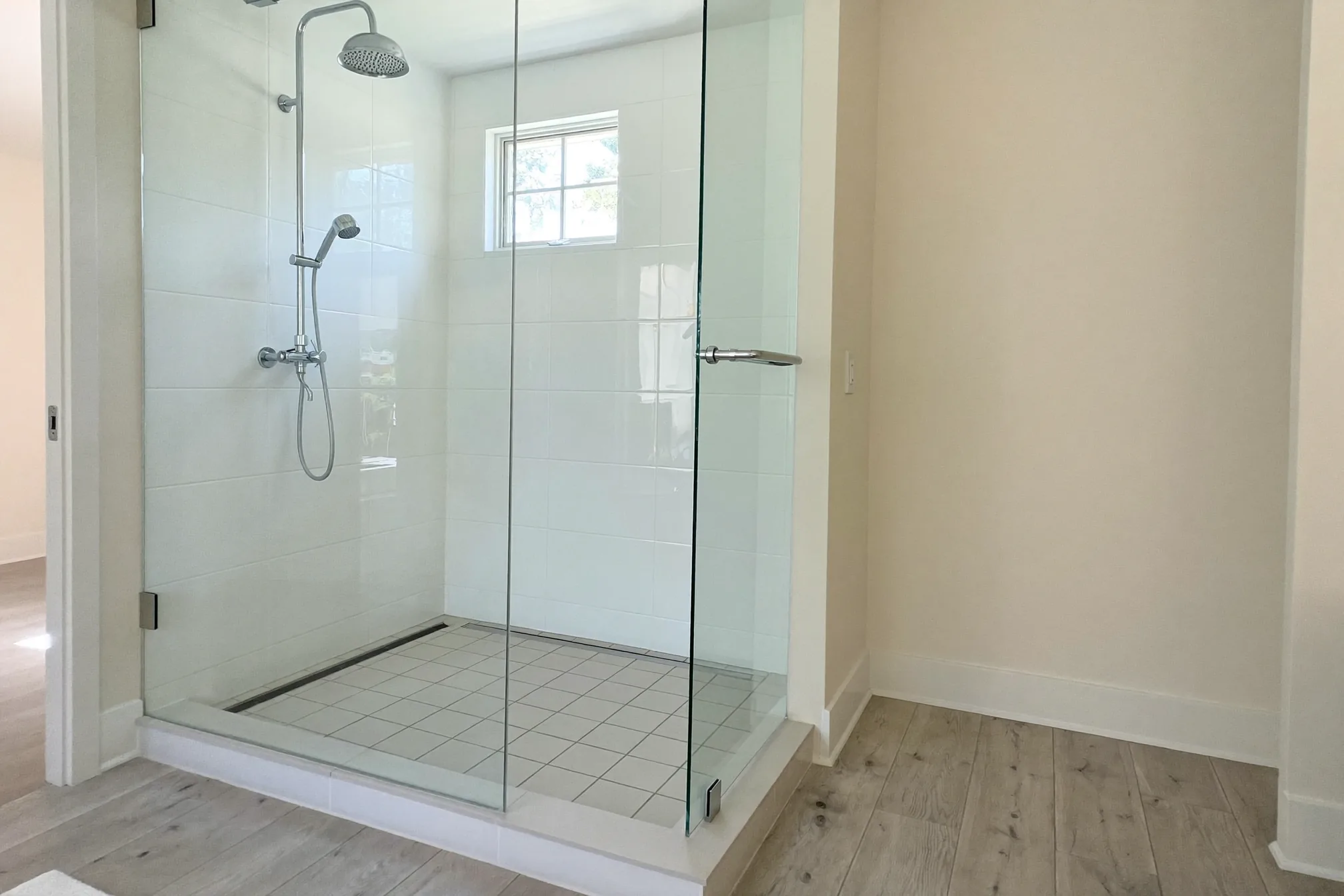 Clean dry shower glass and faucet in an empty Las Vegas home