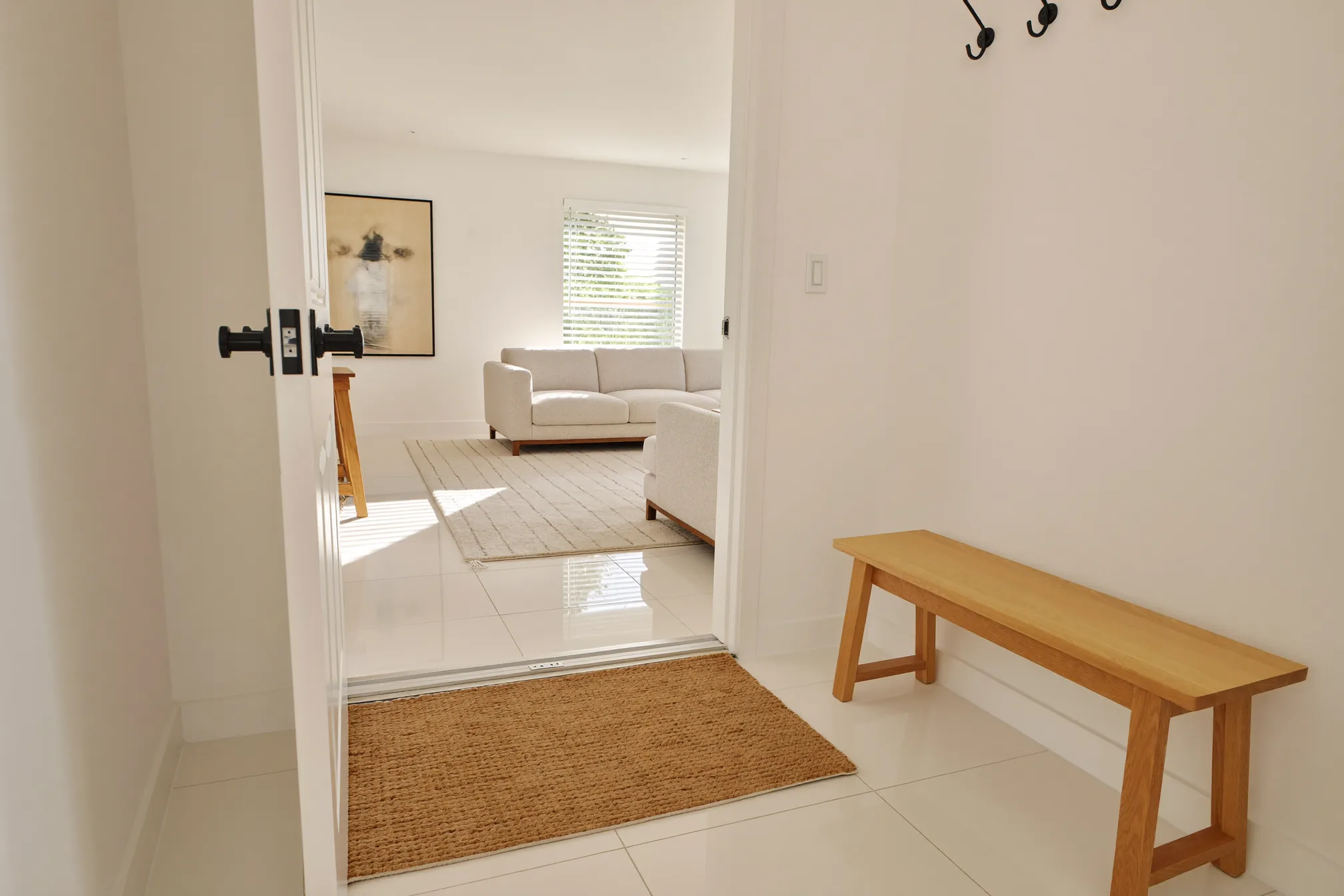 Tidy entryway and living room ready for holiday guests